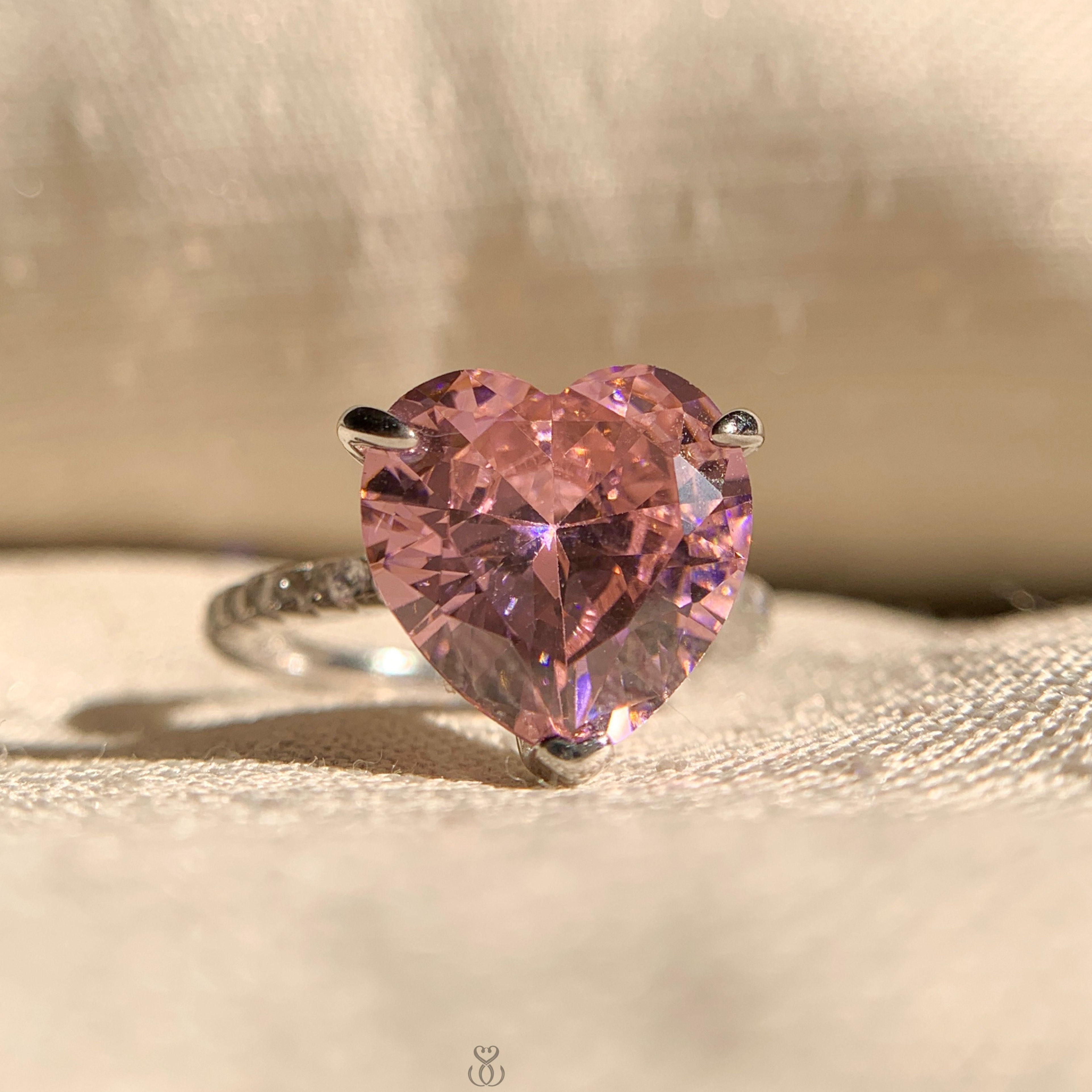 Pink diamond pave band with heart cut solitaire engagement ring in white gold